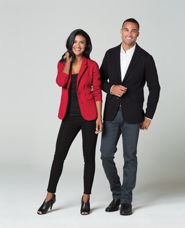 Two people posing in stylish outfits.