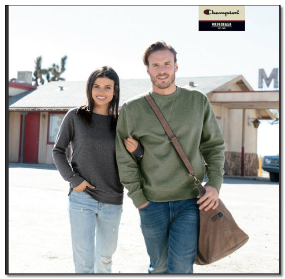 Couple posing outdoors in casual clothing.