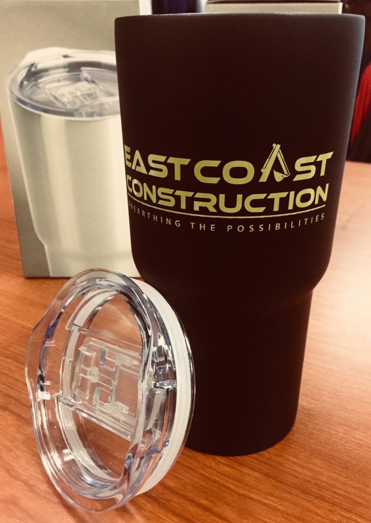 Black tumbler with clear plastic lid.