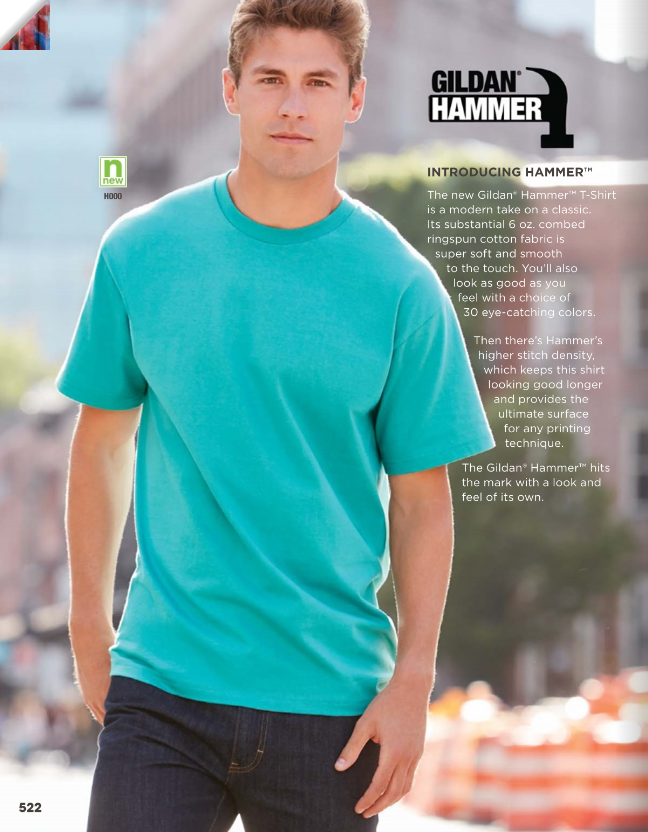 Man wearing teal T-shirt outdoors.