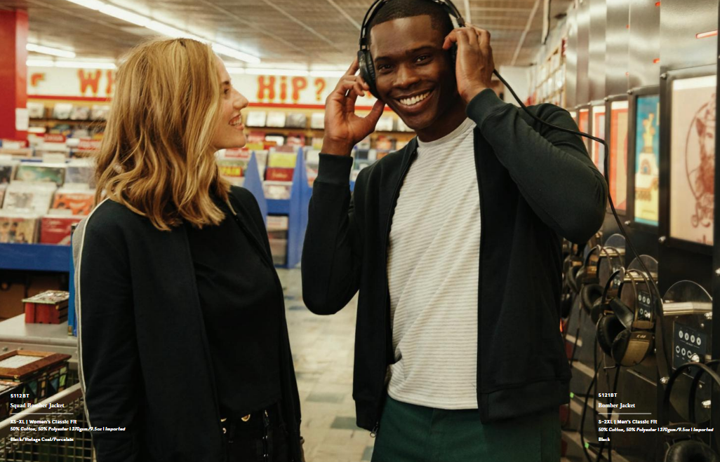 Two people enjoying music in a store.