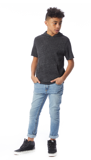 Teen in casual outfit standing and looking sideways.