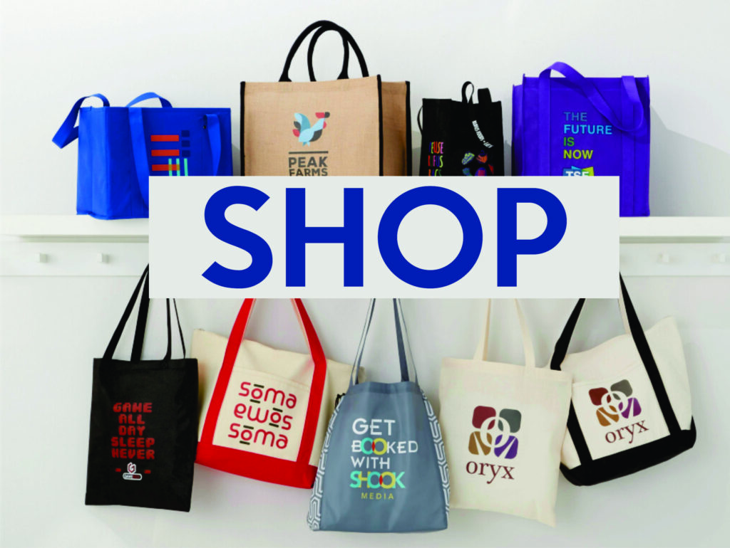 Reusable shopping bags displayed on a shelf.