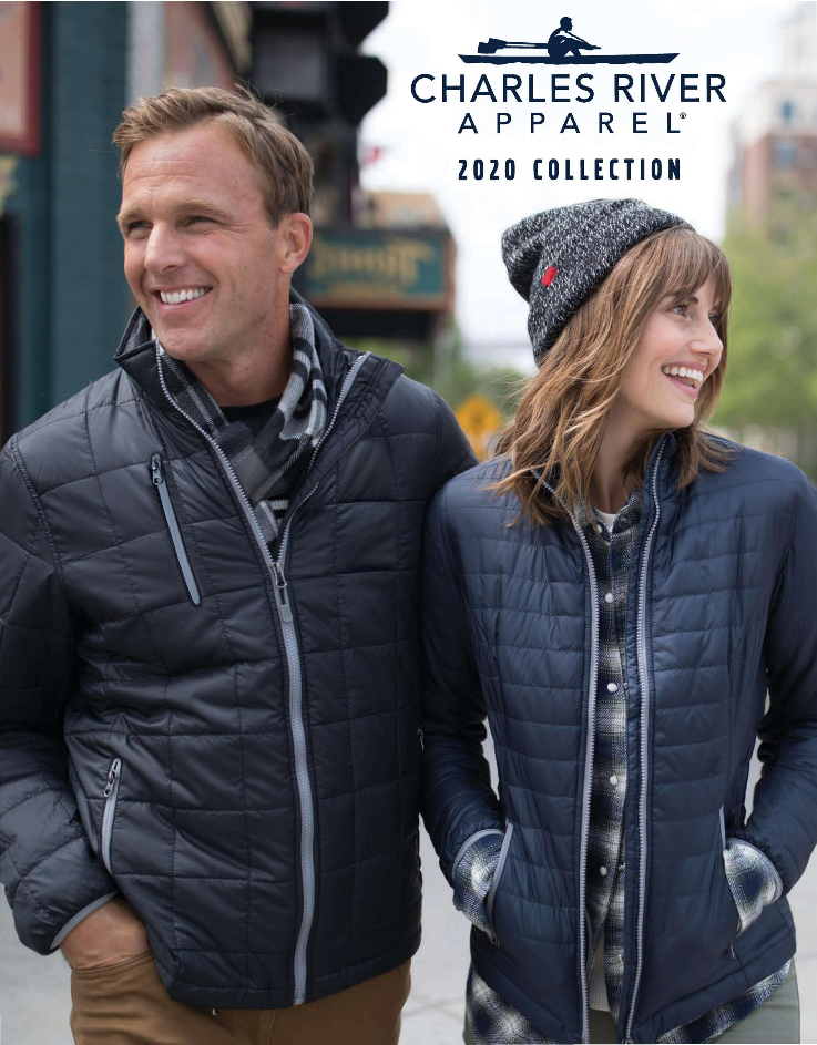A man and woman wearing stylish black jackets, smiling outdoors.
