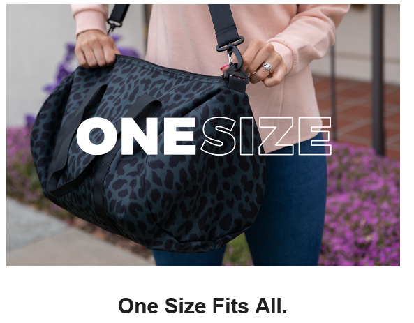 Person holding a large black patterned bag.