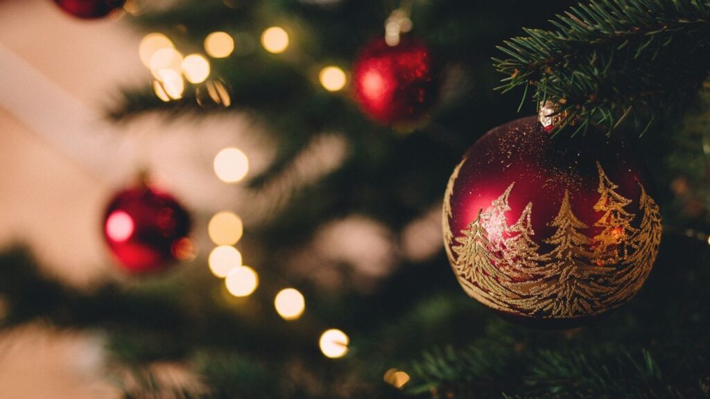 Christmas tree with red and gold ornaments.