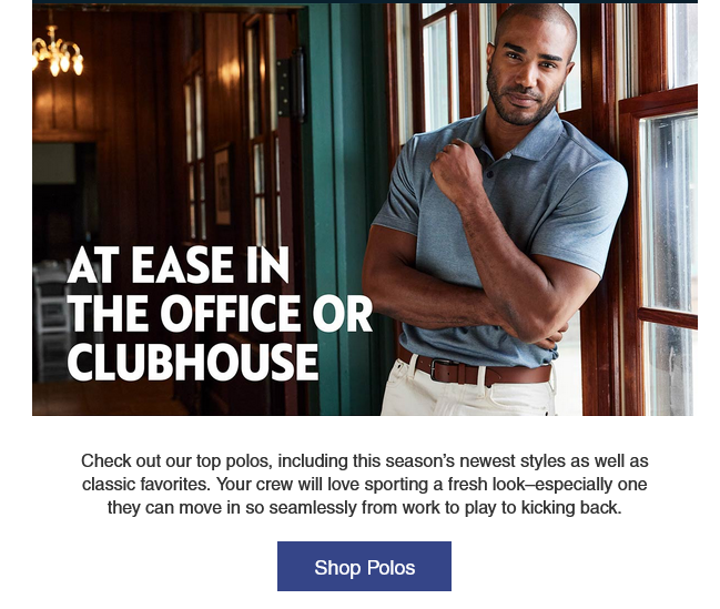 Man in polo shirt by large windows.