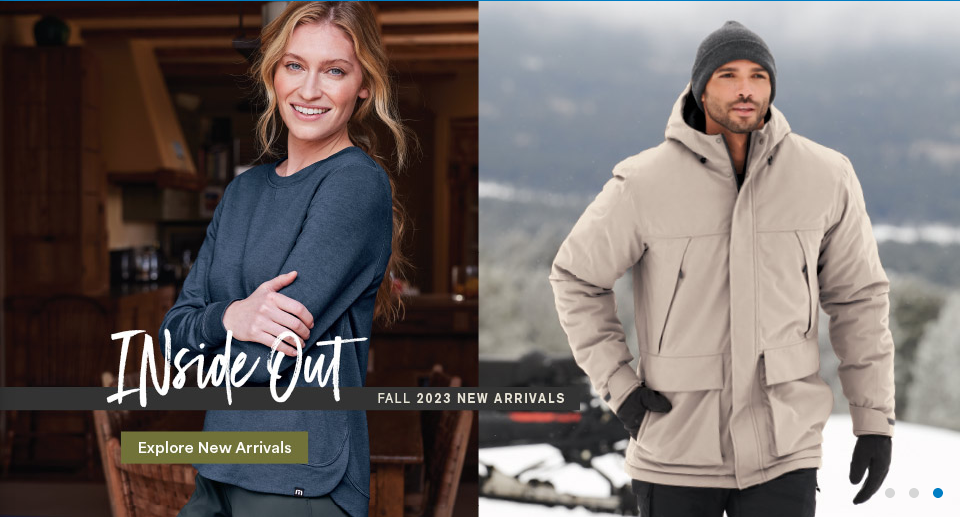 Smiling woman and man in winter clothing.