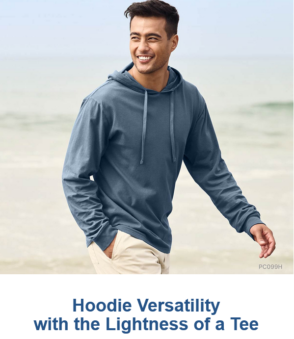 Man wearing blue hoodie on the beach.
