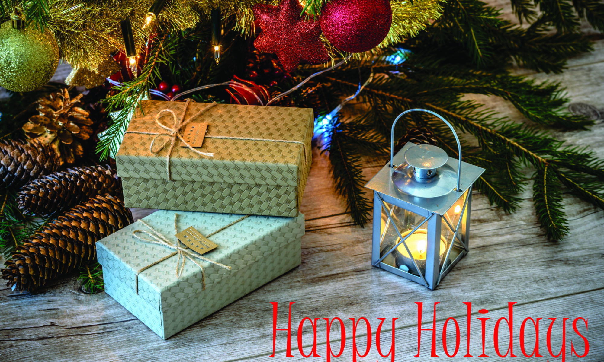 Gifts and lantern under Christmas tree.